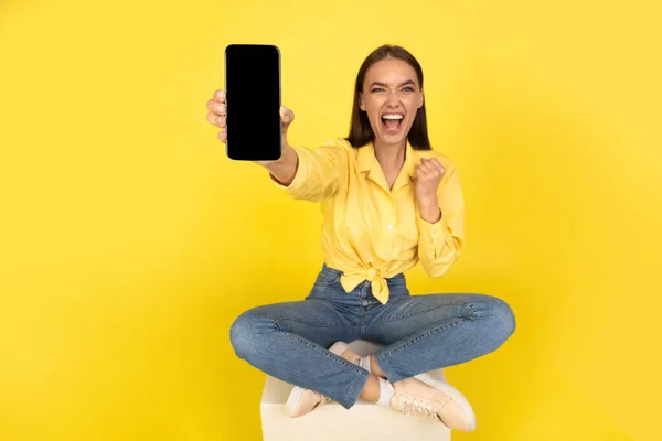 Yes Emotional Woman Showing Cellphone Empty Screen Shouting Shaking Fist — Stock Photo, Image