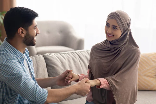 Cheerful Young Islamic Spouses Holding Hands Smiling Each Other Posing — Stock Photo, Image