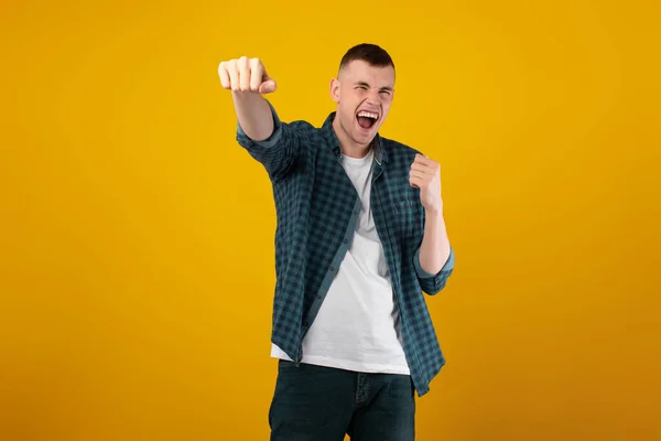 Emotional Young Man Shouting Celebrating Victory Shaking Fists Posing Yellow — Stok Foto