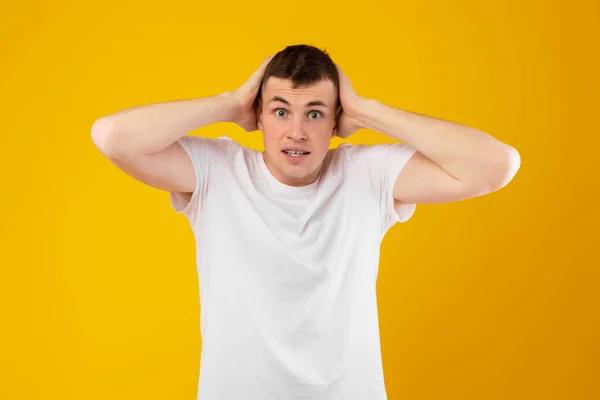 Shocked Millennial Man Touching Head Looking Camera Suffering Anxiety Posing — Stock Photo, Image