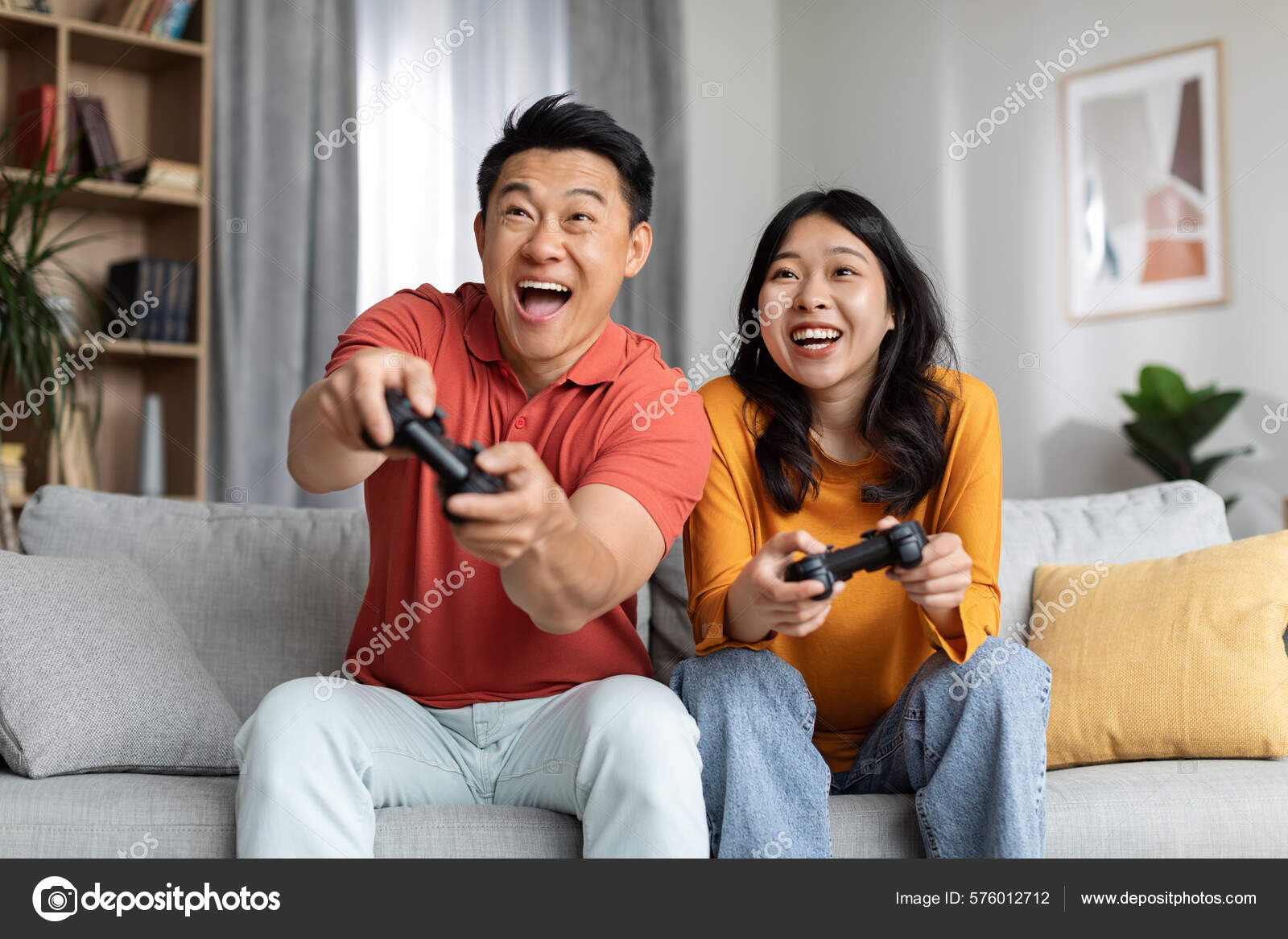 Excited Funny Korean Couple Playing Video Games Home Happy Asian