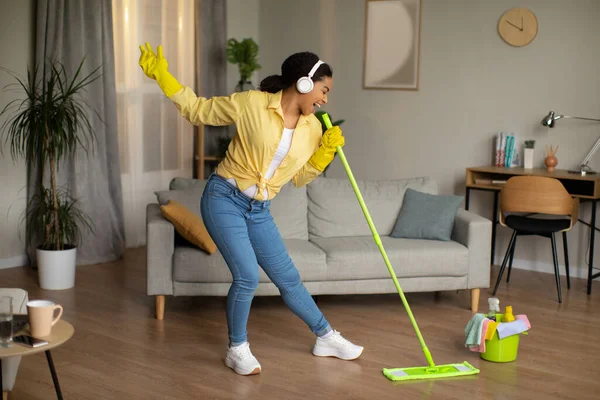 Happy African American Lady Mopping Floor Singing Favorite Song Holding — Fotografia de Stock