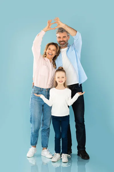 Happy Parents Joining Arms Making Fingers Heart Daughters Head Posing — Stock Photo, Image