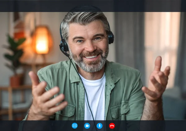 Smiling Senior European Man Beard Headphones Gesturing Looks Camera Screen — Stock Photo, Image