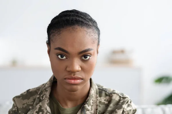 Closeup Shot Of Young Black Soldier Lady With Serious Face Expression, Portrait Of Millennial African American Woman In Military Uniform Looking At Camera While Posing Indoors, Copy Space