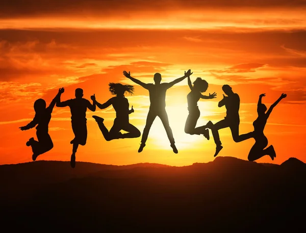 Group Of Black Figures Of Joyful Unrecognizable Young People Jumping Together On Sunset, Happy Carefree Friends Having Fun Outdoors, Positive Men And Women Enjoying Travelling And Hiking, Collage