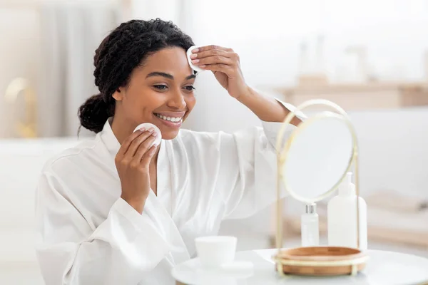Beauty Routine Smiling Black Female Looking Mirror Cleansing Skin Cotton — Stockfoto