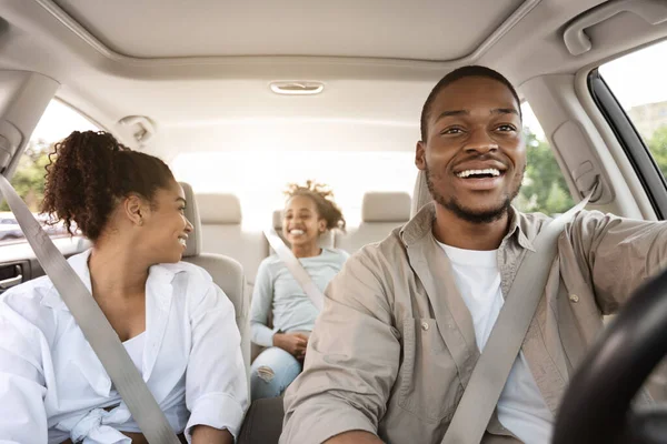 Car Ownership. Happy Black Parents And Daughter Sitting In Auto During Road Trip In Summer. Family Traveling By Automobile. Vehicle Purchase And Leasing. Selective Focus