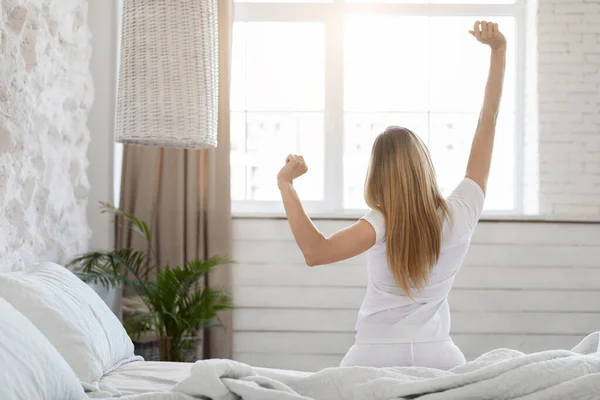 Unrecognizable Blonde Woman Long Hair Sitting Stretching Comfy Bed Raising — Foto Stock