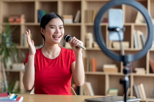 Satisfied Young Japanese Lady Microphone Sings Microphone Karaoke Shoots Video —  Fotos de Stock