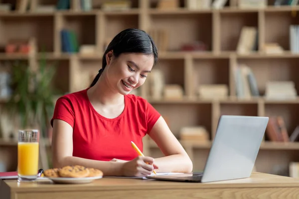 Smiling Happy Adolescent Chinese Female Doing Homework Laptop Have Breakfast — Foto de Stock