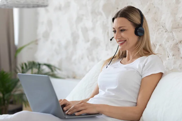 Happy Young Blonde Woman Freelancer Working Home Sitting Bed Wearing —  Fotos de Stock