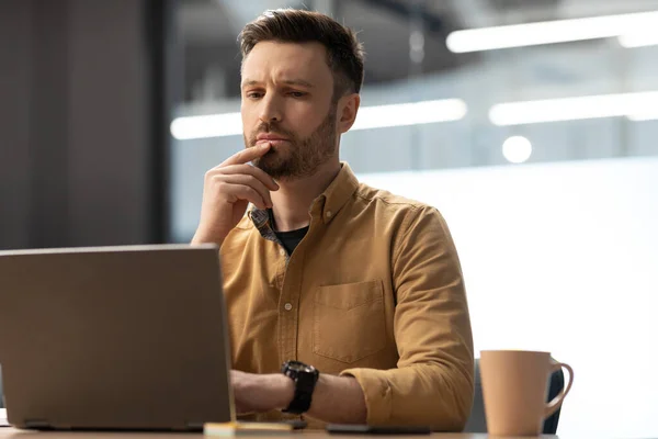 Thoughtful Businessman Working Online Laptop Computer Sitting Modern Office Male — Stockfoto