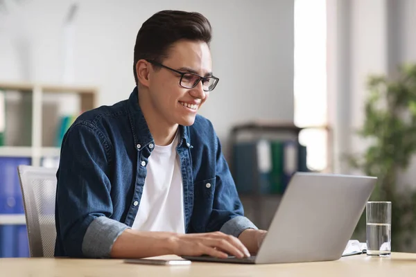 Handsome Young Businessman Glasses Working Laptop Modern Office Smiling Millennial — Stock Fotó