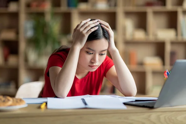 Unhappy Tired Young Chinese Girl Holding Hands Head Doing Homework — Foto de Stock