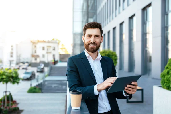 Smiling Handsome Confident European Millennial Bearded Businessman Suit Uses Tablet — Stock Fotó