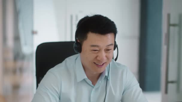 Close Portrait Positive Middle Aged Asian Businessman Wearing Headset Mic — Αρχείο Βίντεο