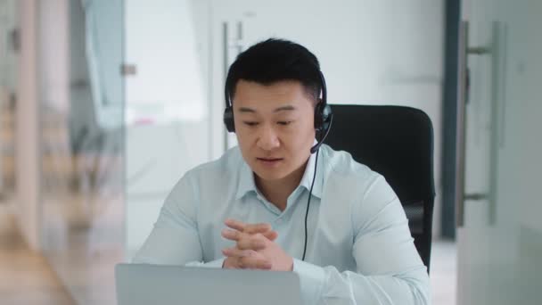 Virtual Meeting Concept Serious Middle Aged Asian Businessman Wearing Headset — Αρχείο Βίντεο