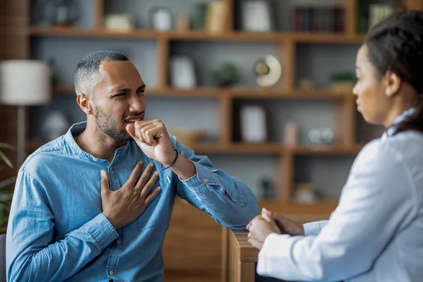 Sick Young Arab Man Coughing Touching His Chest While Having —  Fotos de Stock