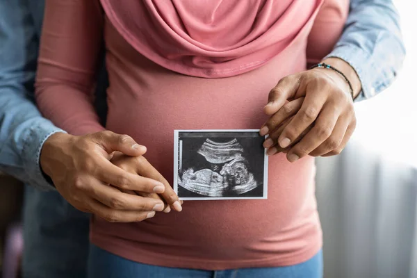 Pregnant Muslim Woman Her Husband Holding Baby Sonogram Picture While — Stock Photo, Image