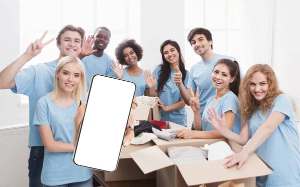 Volunteering App Multiethnic Group Volunteers Showing Big Blank Smartphone While — Fotografia de Stock