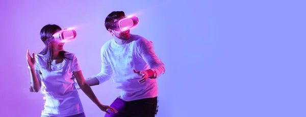 Millennial Guy Lady Newest Virtual Reality Glasses Having Fun Neon — Zdjęcie stockowe