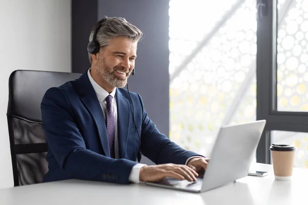 Telecommuting Concept Successful Middle Aged Manager Wearing Headset Working Laptop — Stock Photo, Image