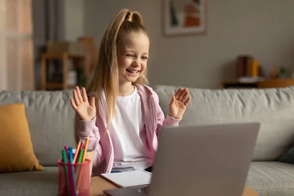 Learning Cheerful Schoolgirl Making Video Call Waving Hello Laptop Computer — 图库照片