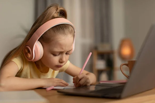 Learning Schoolgirl Taking Notes Doing Homework Online Using Laptop Computer — Fotografia de Stock