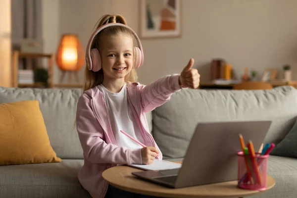 Little School Girl Showing Thumbs Laptop Computer Wearing Headset Approving — Stock fotografie