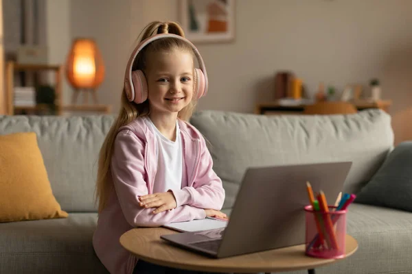 Online Learning Cute Schoolgirl Using Laptop Wearing Pink Headphones Posing — Fotografia de Stock