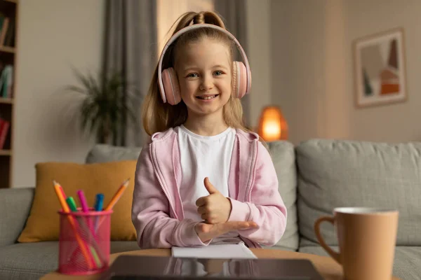 Learning Cheerful School Girl Sitting Front Laptop Screen Gesturing Thumbs — Fotografia de Stock