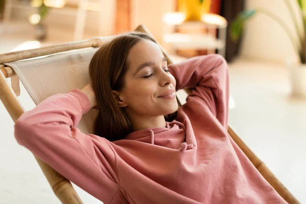 Carefree Happy Teenage Girl Relaxing Chair Hands Her Head Spending — Foto de Stock
