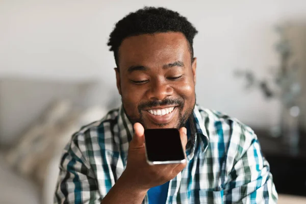 Cheerful African American Man Using Voice Search Smartphone Sitting Home — Φωτογραφία Αρχείου
