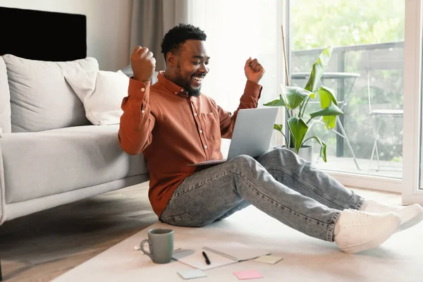 Joyful Black Man Using Laptop Computer Working Online Shaking Fists —  Fotos de Stock