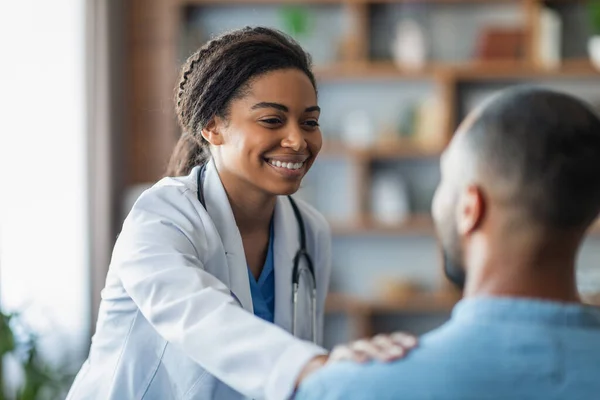 Cheerful Attractive Young African American Woman Doctor Touching Unrecognizable Eastern — Photo