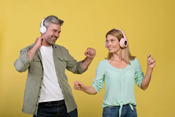 Enjoy Music Together Happy Middle Aged Spouses Wireless Headphones Listening — Fotografia de Stock