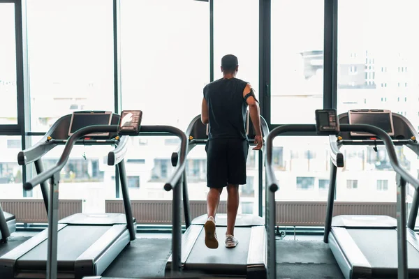 Sporty Lifestyle Unrecognizable Black Man Jogging Treadmill Panoramic Window Gym — Stock fotografie