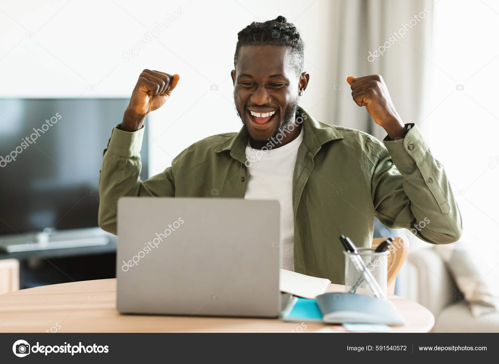 Overjoyed Black Man Gesturing Yes Front Laptop Celebrating Success.