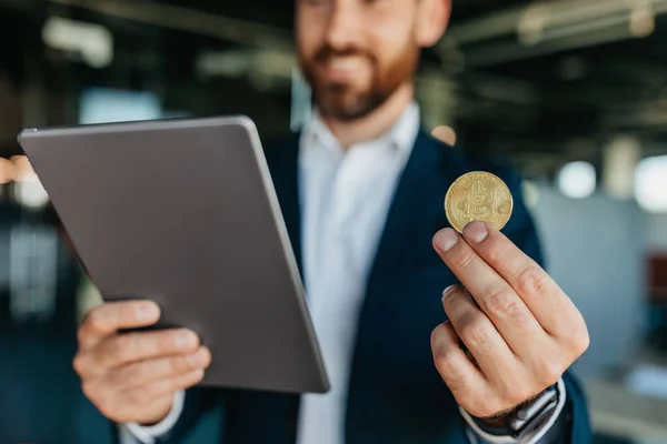 Confident Businessman Holding Golden Bitcoin Working Charts Digital Tablet Standing — Foto de Stock