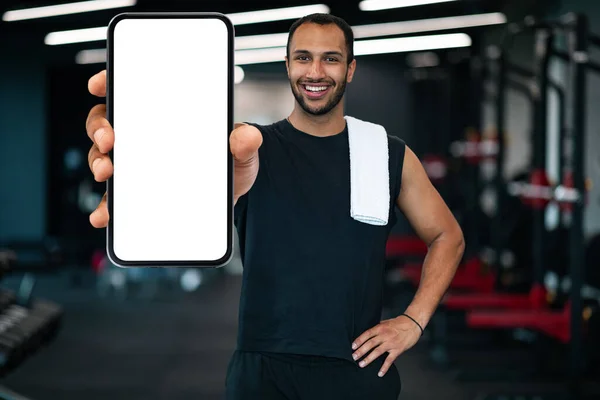 Fitness App Sporty Black Guy Showing Smartphone Blank White Screen — Stok fotoğraf