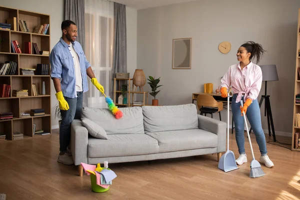 Housework African American Millennial Couple Cleaning Room Doing House Chores — Fotografia de Stock