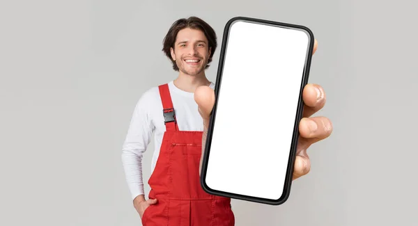 Handyman Services Concept Mobile App Portrait Smiling Young Workman Uniform —  Fotos de Stock