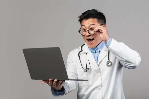 Shocked Cheerful Millennial Asian Man Doctor White Coat Open Mouth — Zdjęcie stockowe