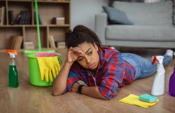 Sad Tired Millennial African American Woman Housewife Cleaning Supplies Lying — Foto Stock