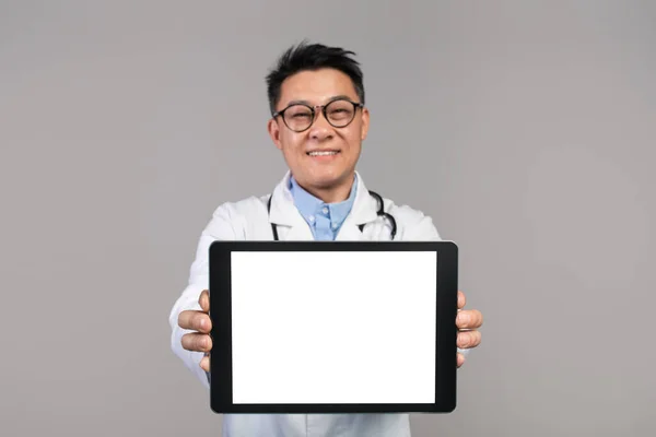 Happy Confident Adult Japanese Doctor White Coat Glasses Shows Tablet — Φωτογραφία Αρχείου