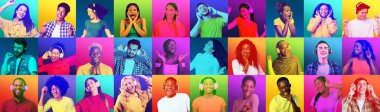 Glad shocked bright millennial international people in headphones dance, listen favorite music, sing, enjoy free time on colorful background. Fun with device, facial expressions and emotions of people