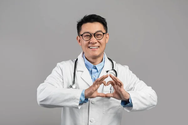 Cheerful Middle Aged Japanese Male Doctor White Coat Glasses Shows — стоковое фото