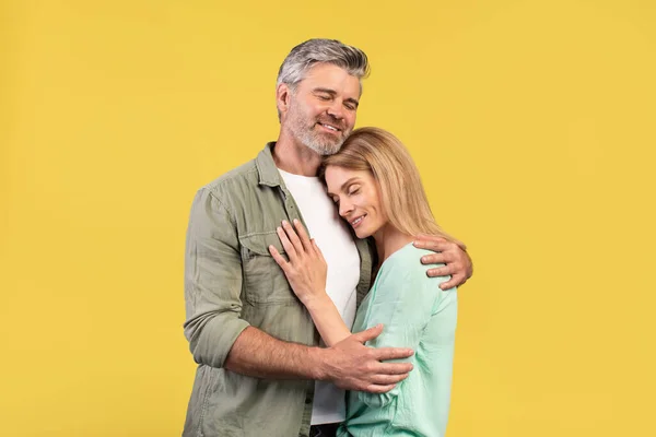 Portrait Loving Middle Aged Spouses Hugging Closed Eyes While Standing — Stockfoto