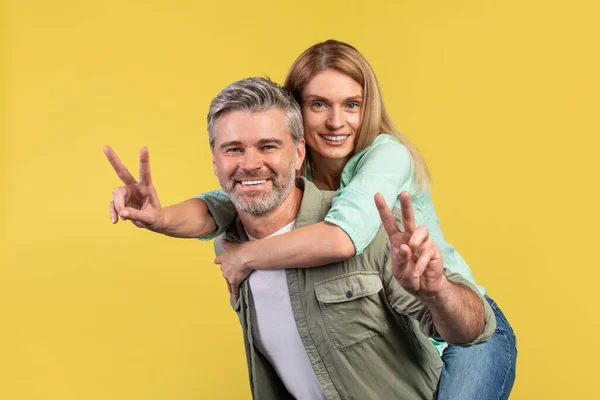 Happy European Middle Aged Spouses Having Fun Together Showing Sign — Stockfoto